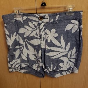 Hawaiian print shorts.